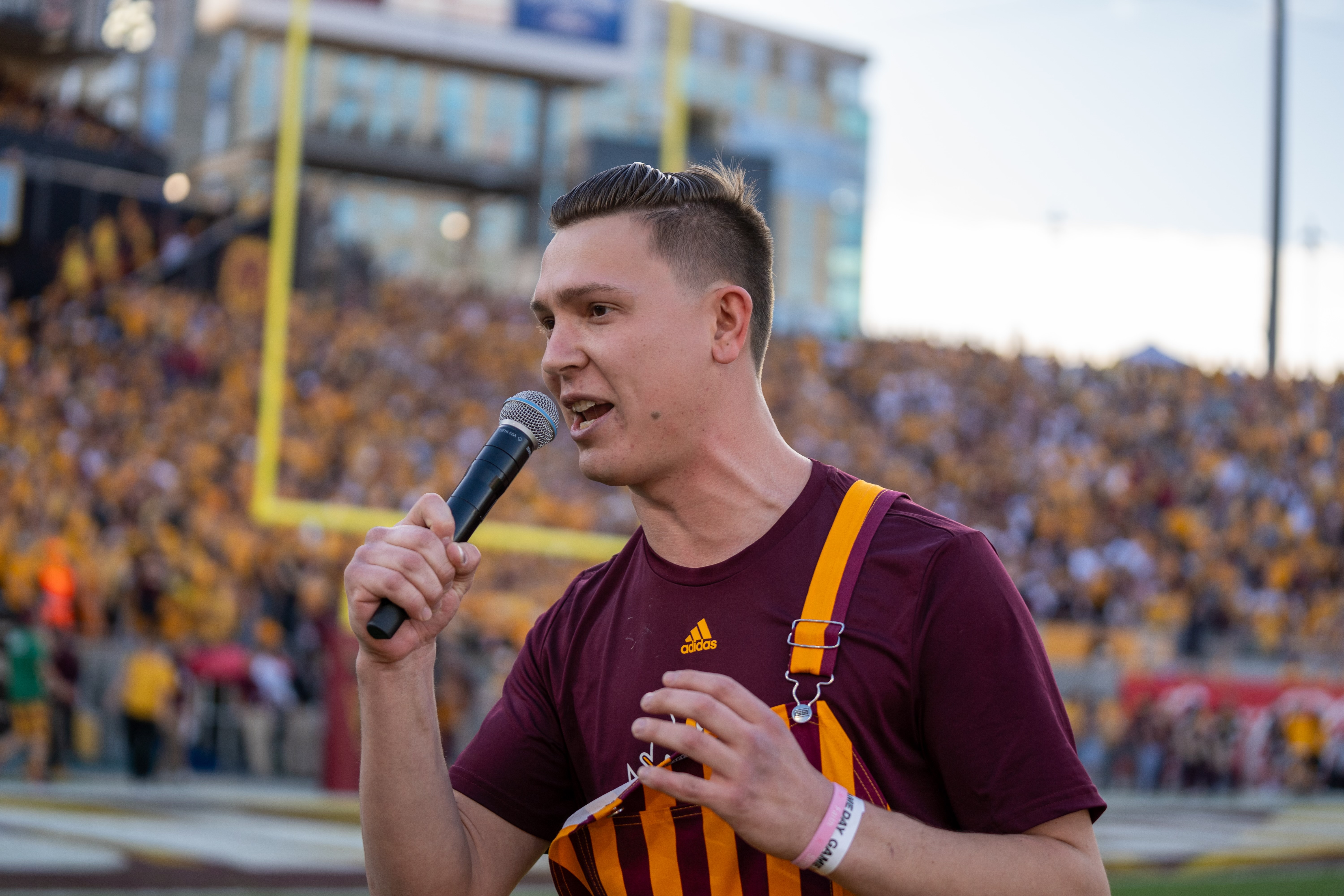 Sam Datin hosting on the field